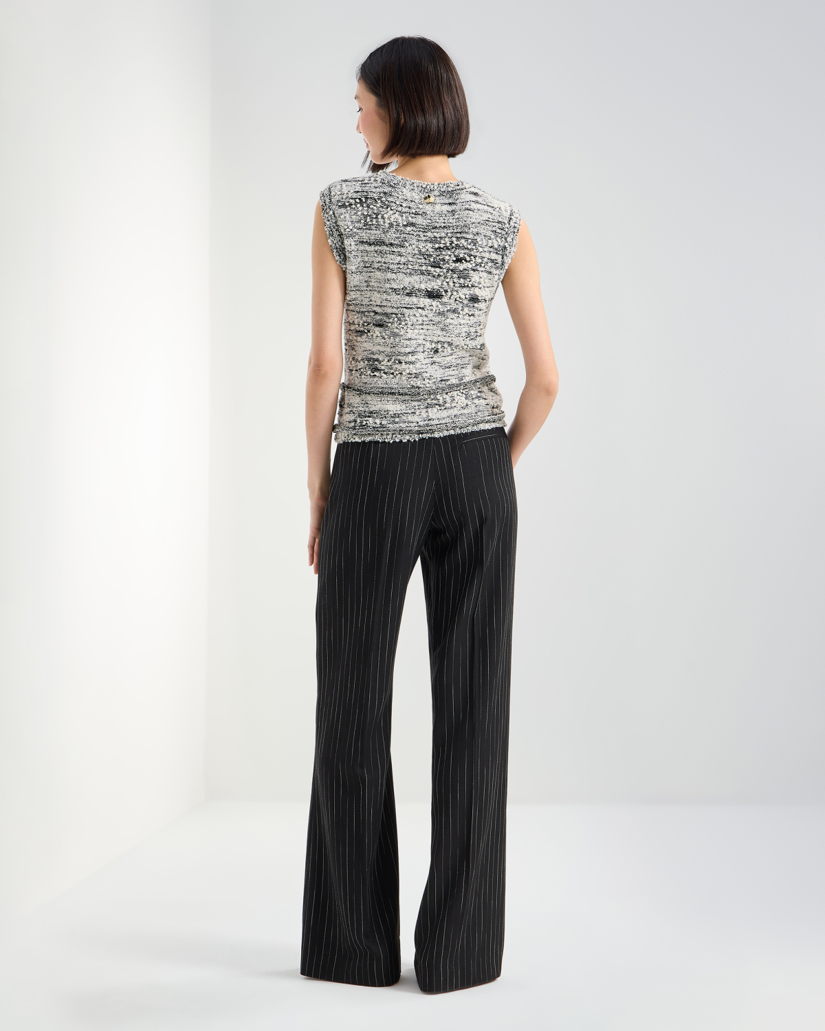 Sleeveless bouclé knit top with sequins | Pre Fall Collection 2026-27, Knitwear | Genny